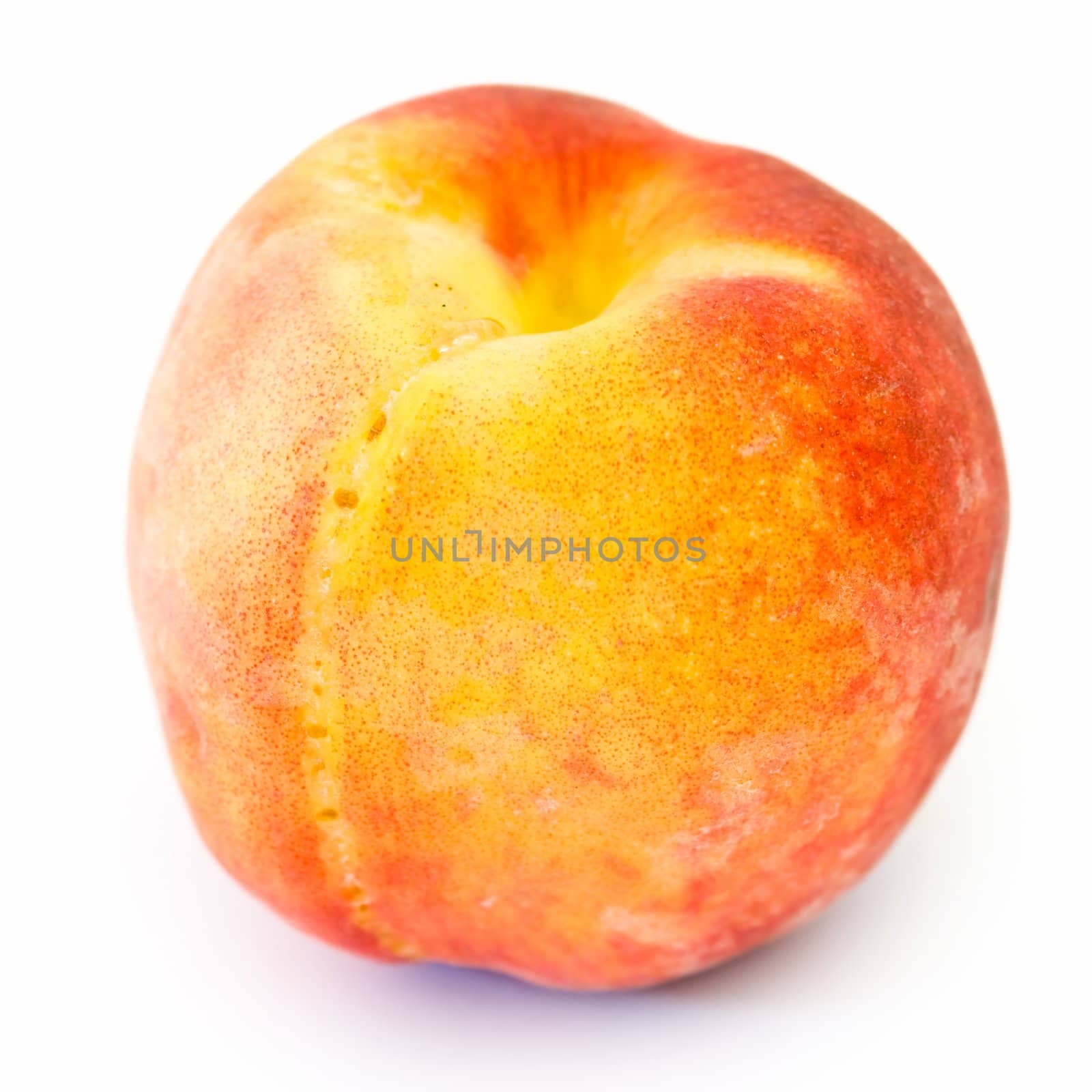 big ripe peach on white a background