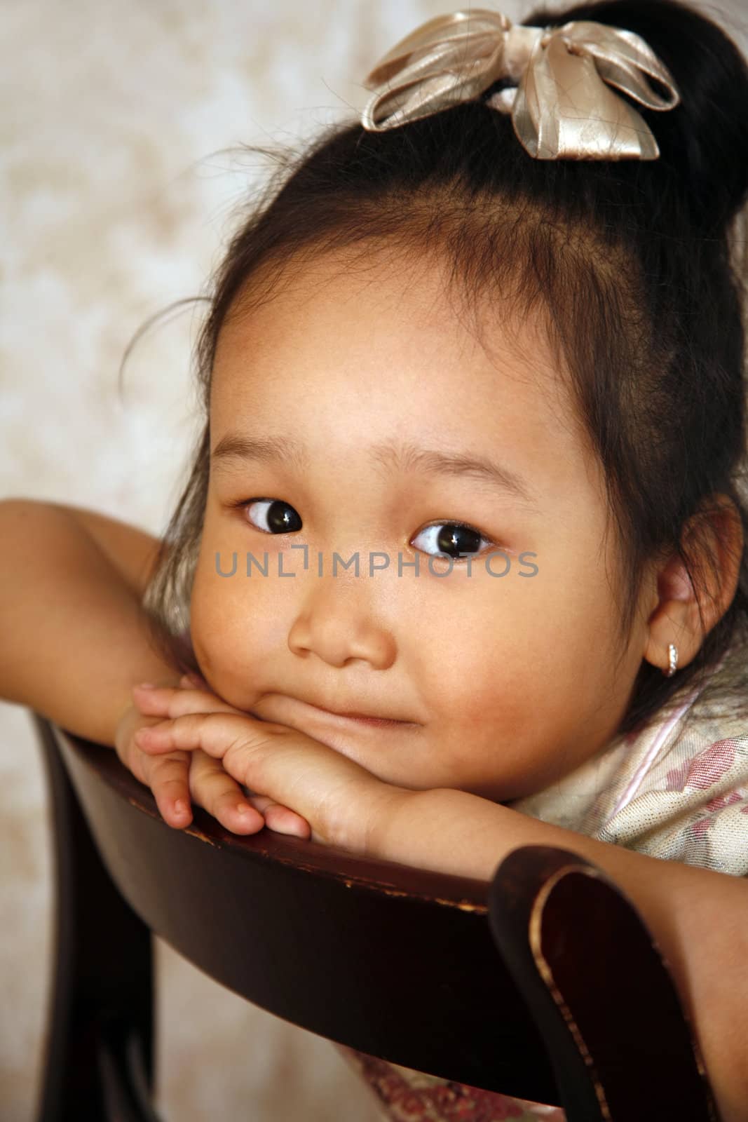 Portrait of the small Korean girl of a house