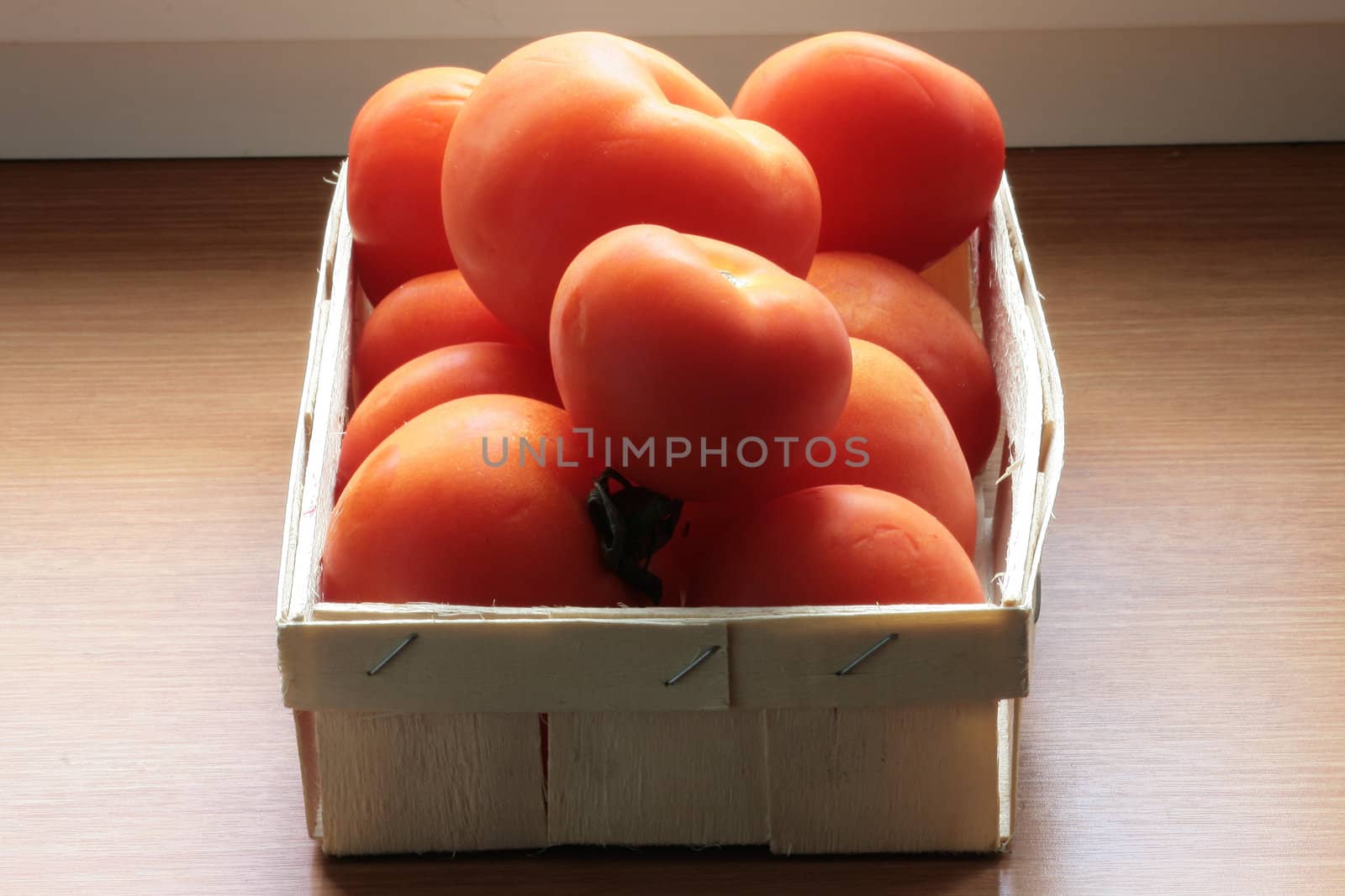 Some red tomatoes in the box