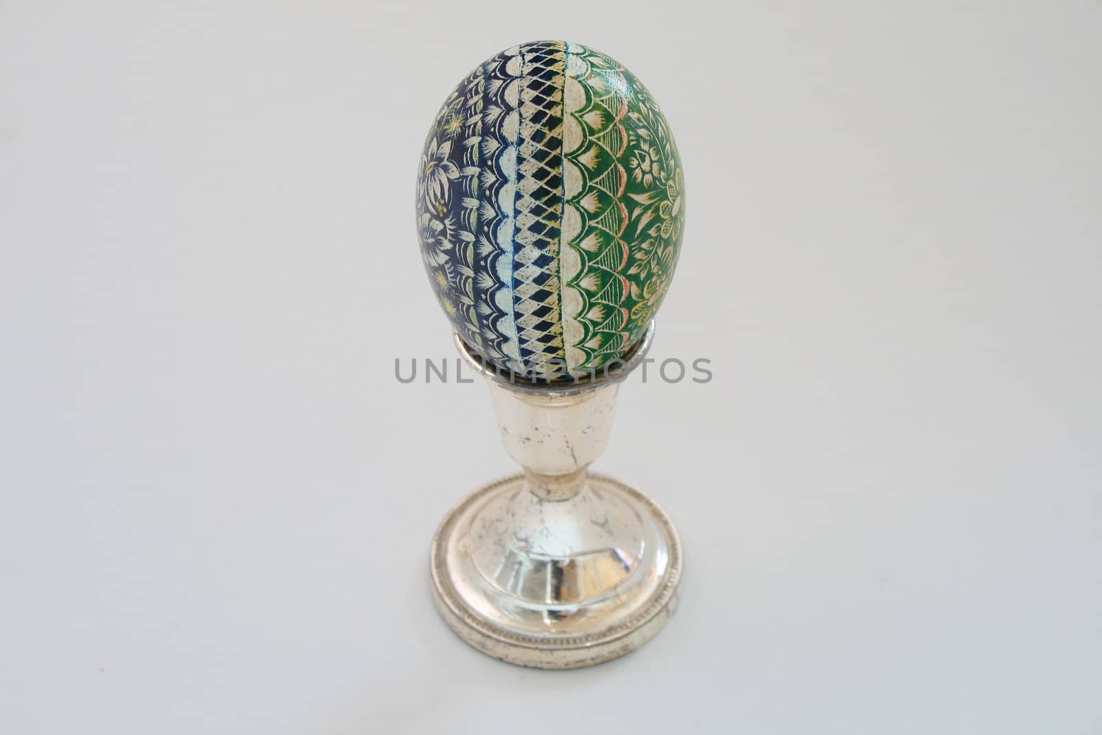 blue & green easter egg on white background
