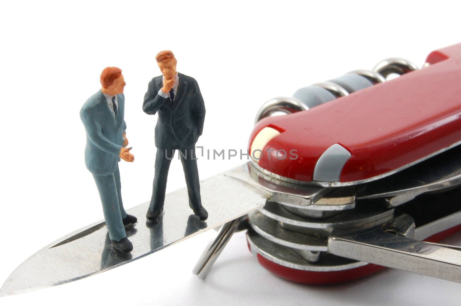 business people on penknife by gunnar3000