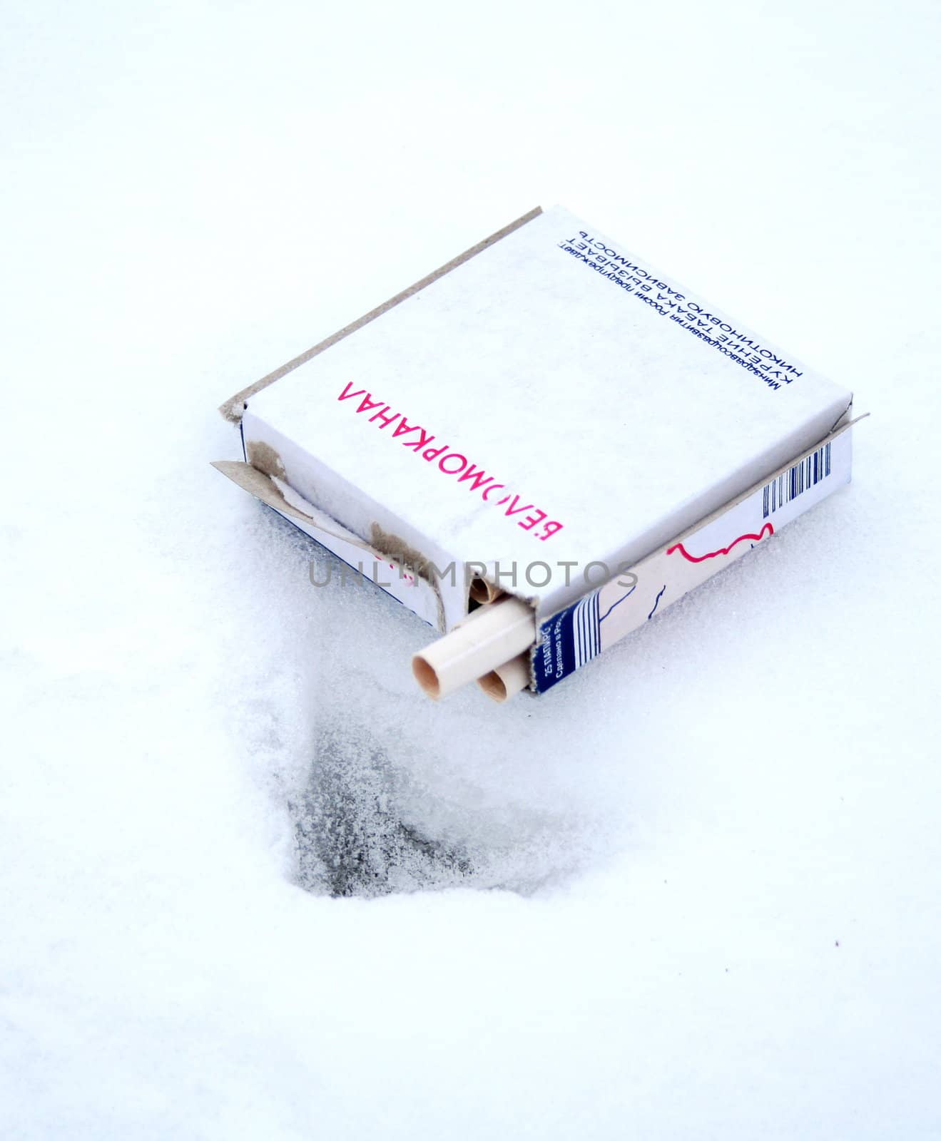 Cigarettes on the snow. Don't smoking!