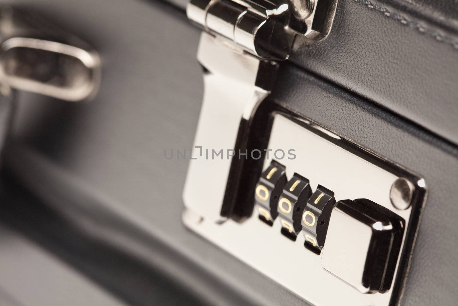 Abstract Close Up Shot of a Black Leather Briefcase Latch and Lock.