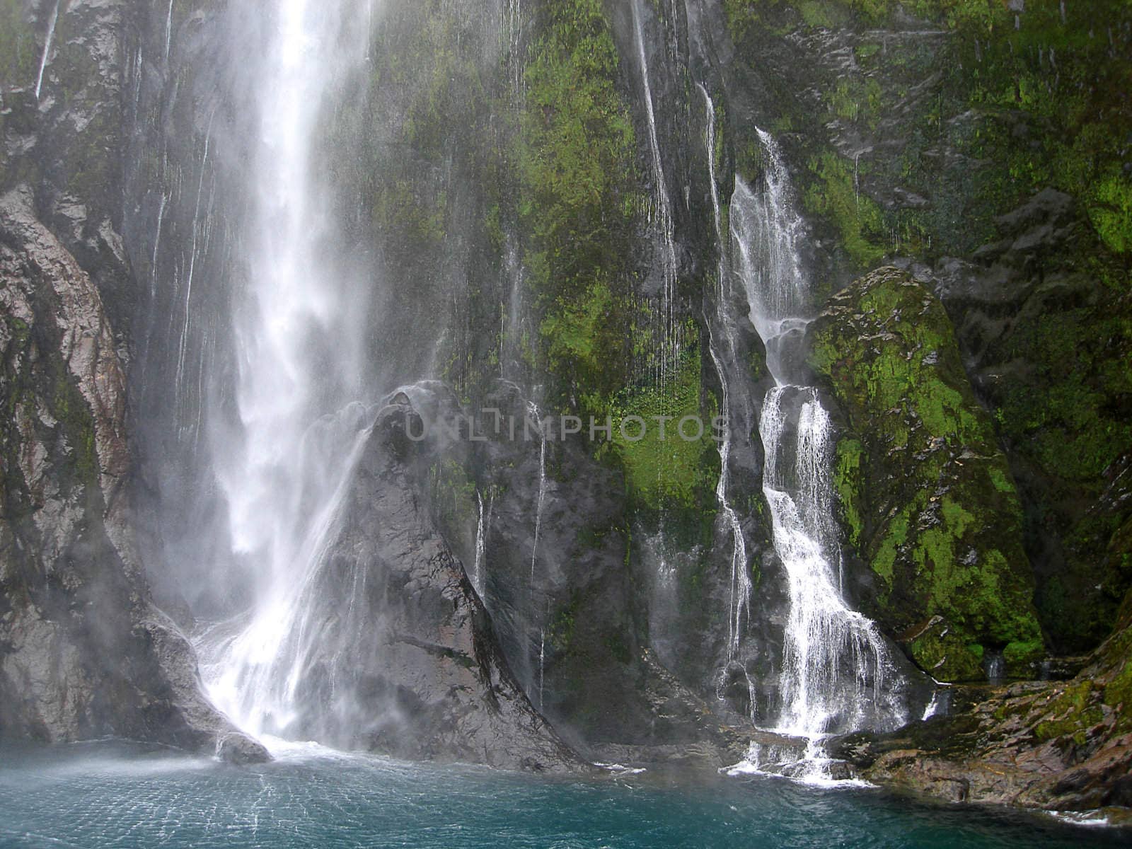 Base of Stirling Falls within Milford Sound, New Zealand.  Te Wahipounamu World Heritage Site