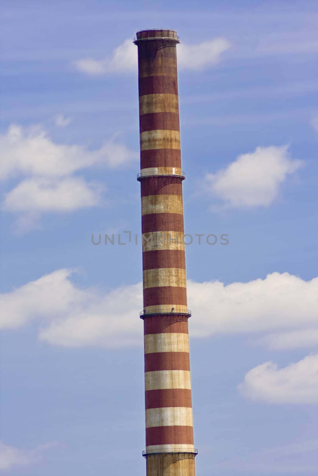 old chimney over beautiful blue sky with clouds