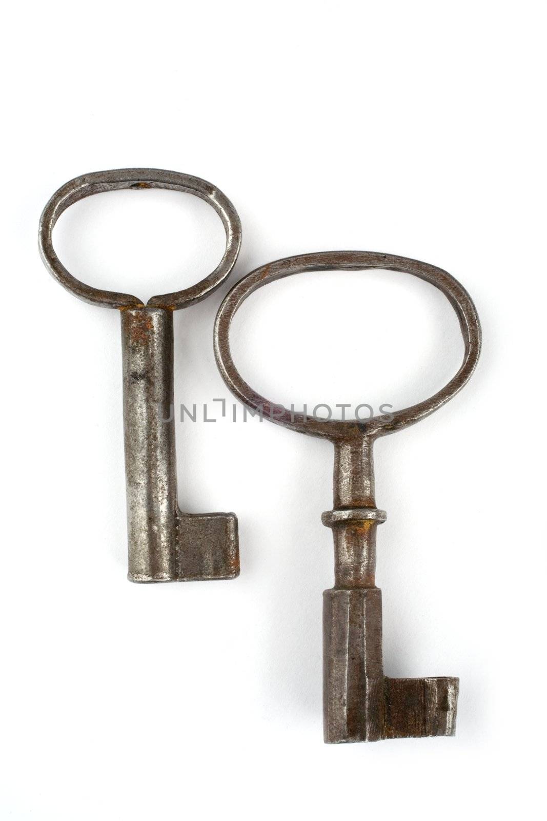 two old keys on a white background