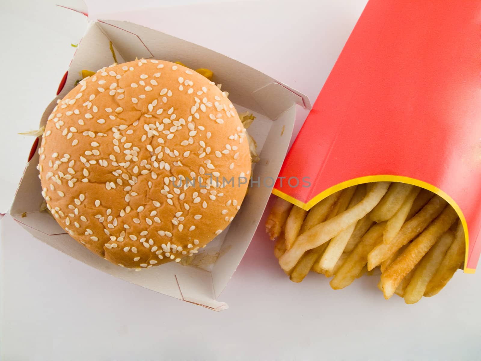 Burger and Fries in Cardboard Fast Unhealthy Food on White Background