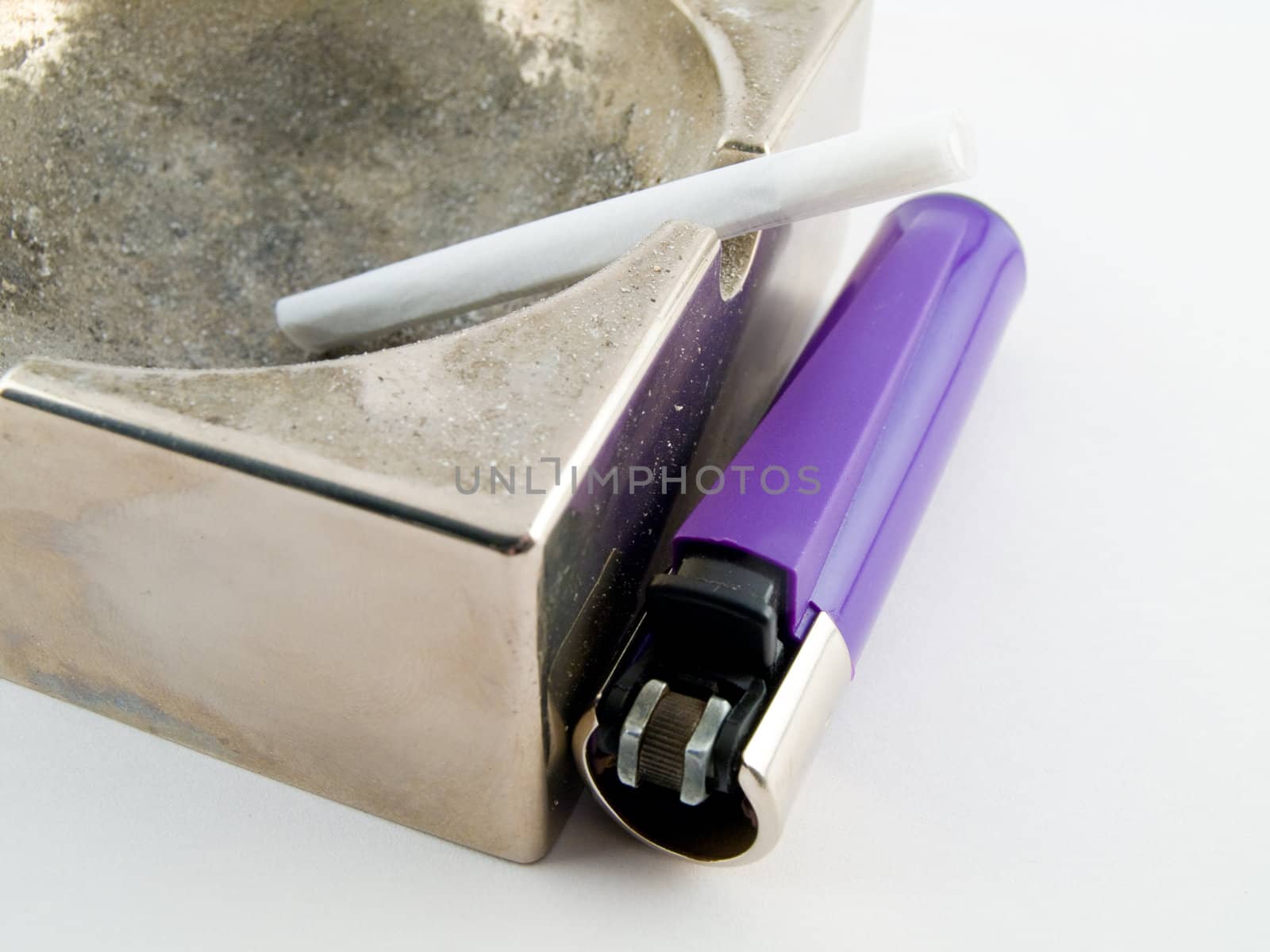 hand rolled cigarette and disposable lighter by bobbigmac