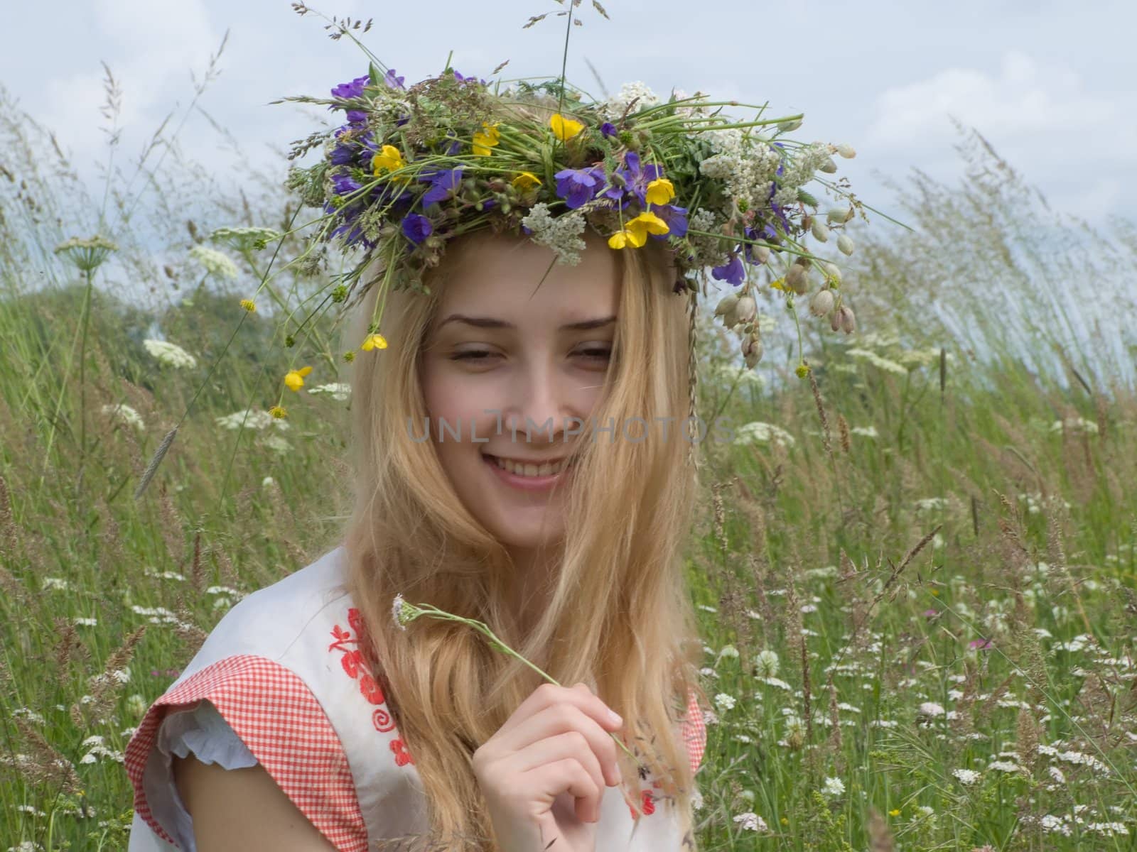 girl in a chaplet from meadow flowers