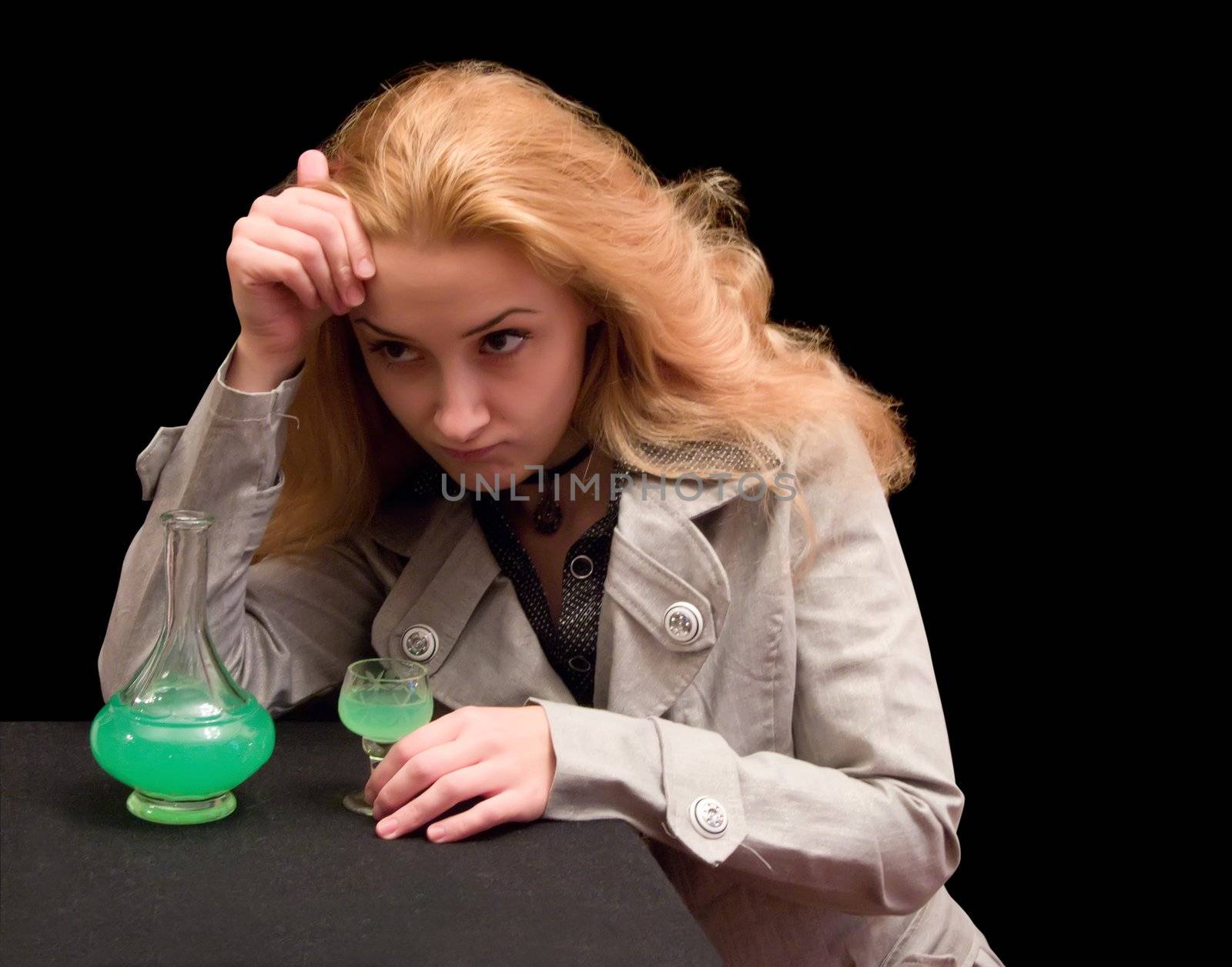 The long-haired girl with a wine-glass of absinthe liqueur