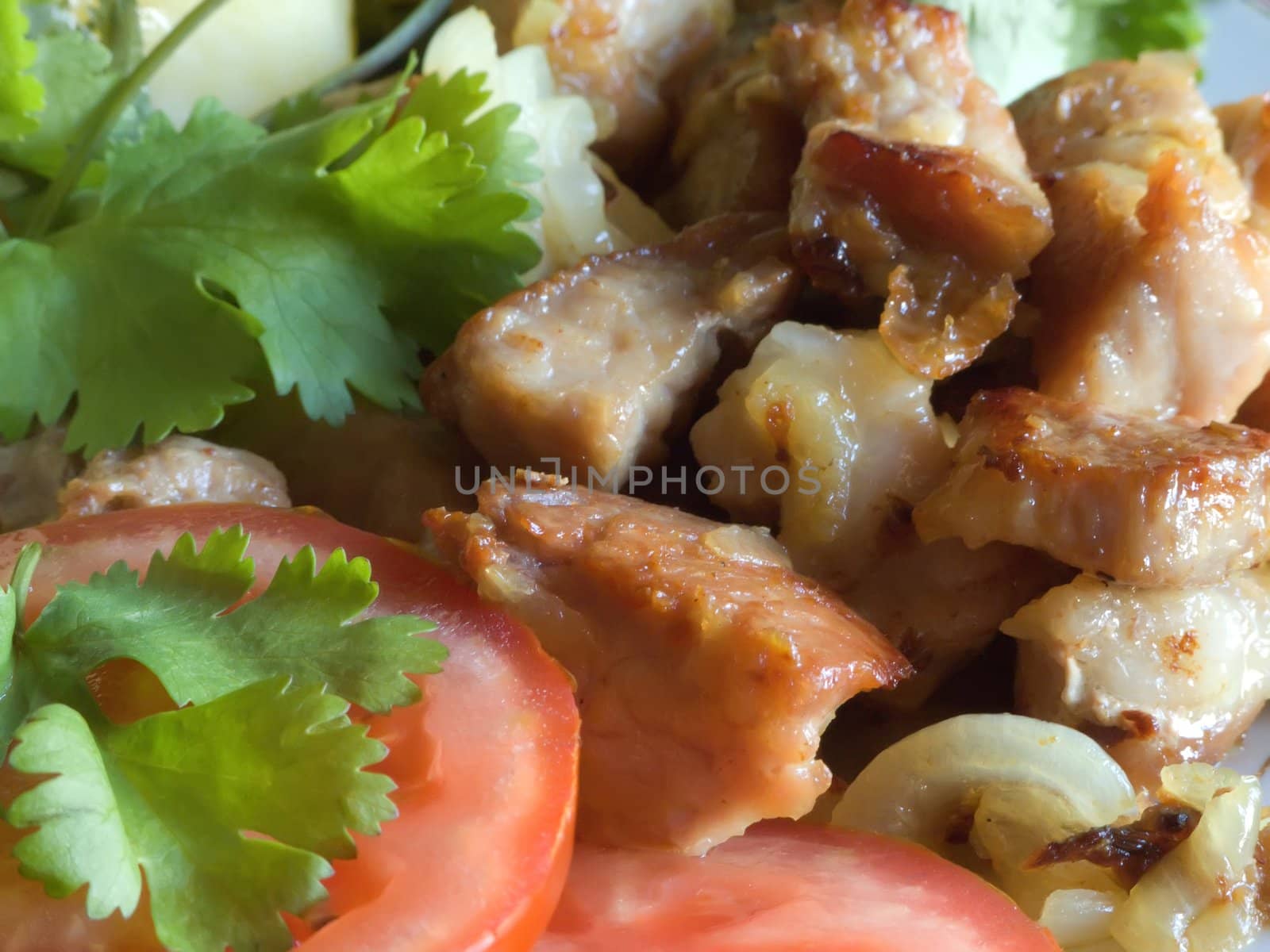 Stewed meat with a potato and tomatoes