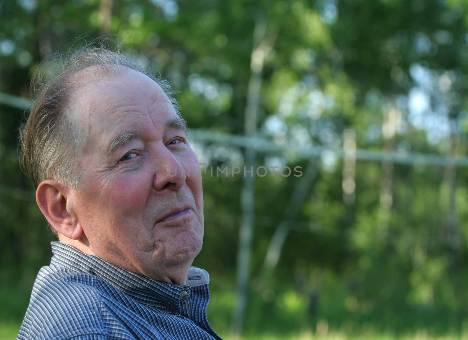 Elderly man enjoying summer outdoors