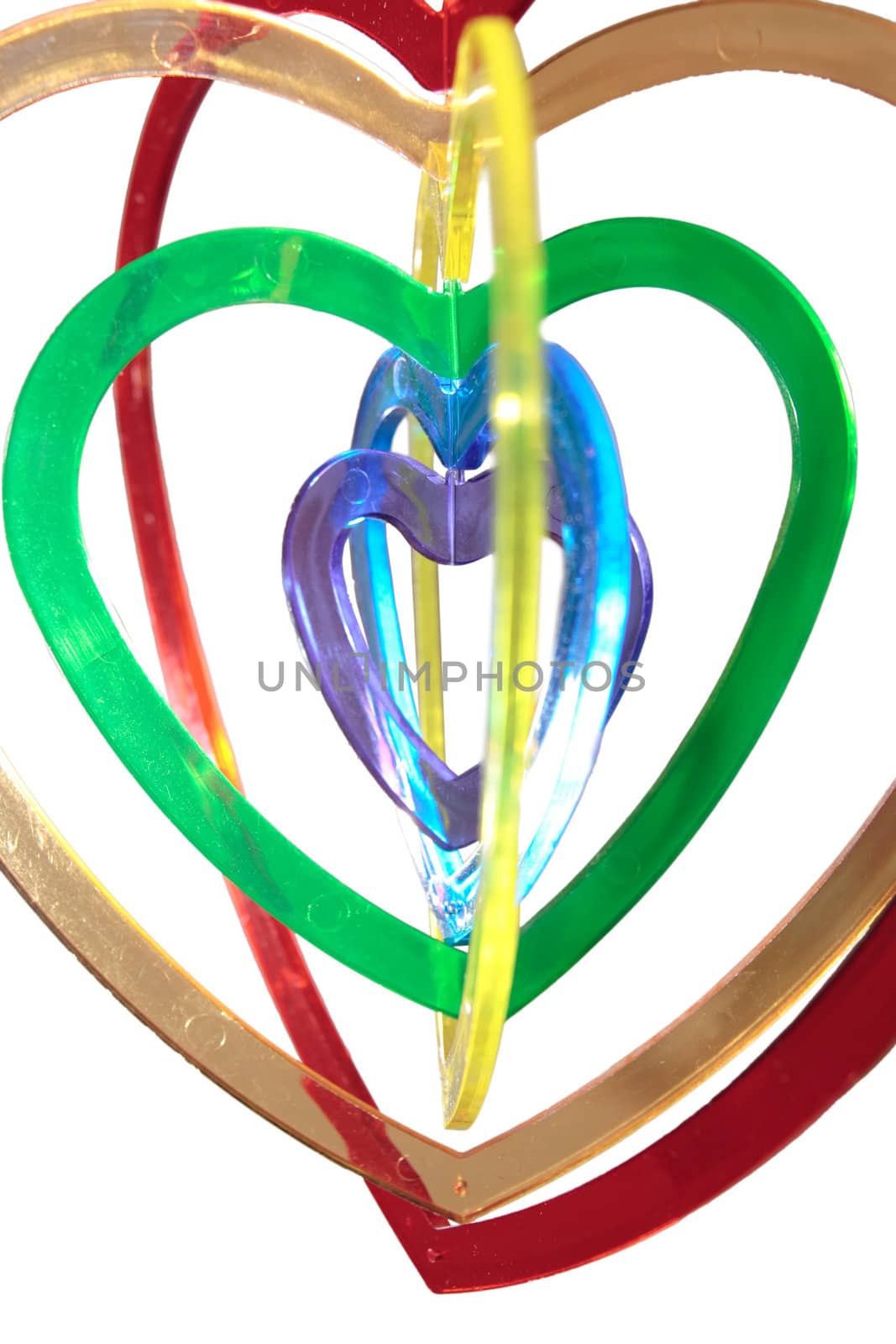 six heart shaped plastic pieces one inside the other on a white background