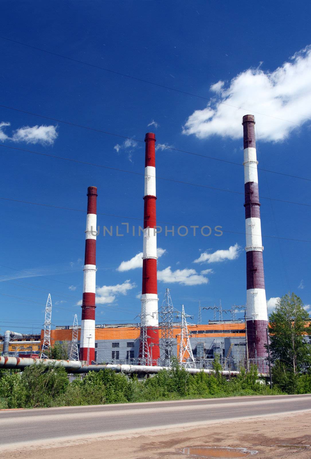 factory chimneys under blue sky