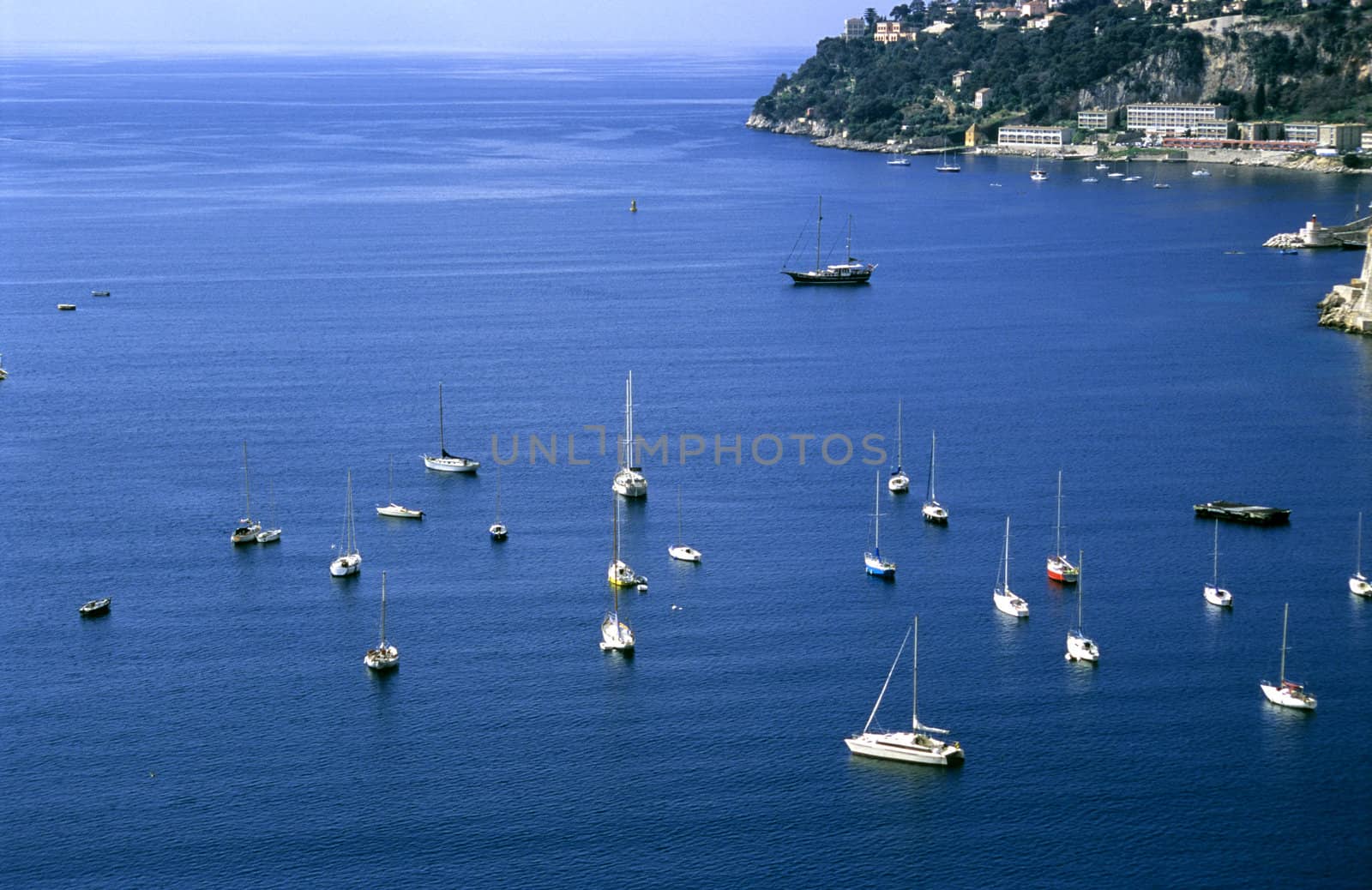 Sailboats of all different sizes dot the Mediterranean coast of France.