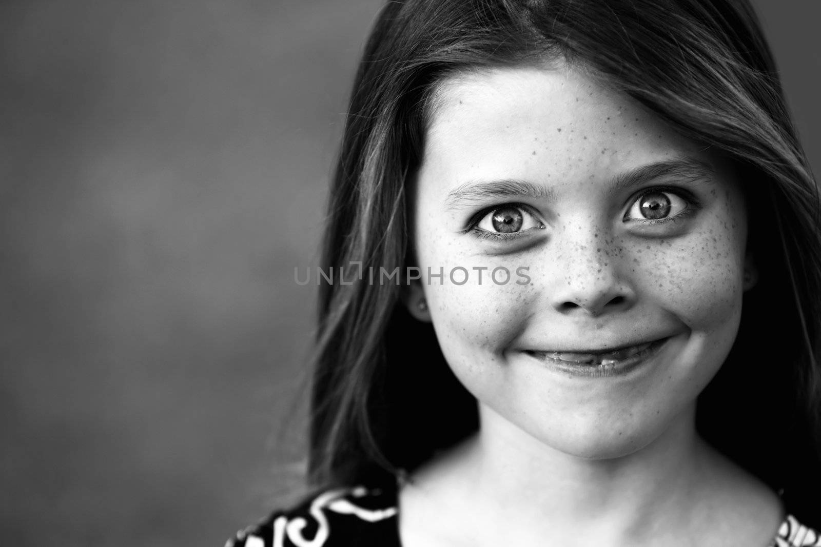 Pretty Young Girl with Freckles and a Big Smile