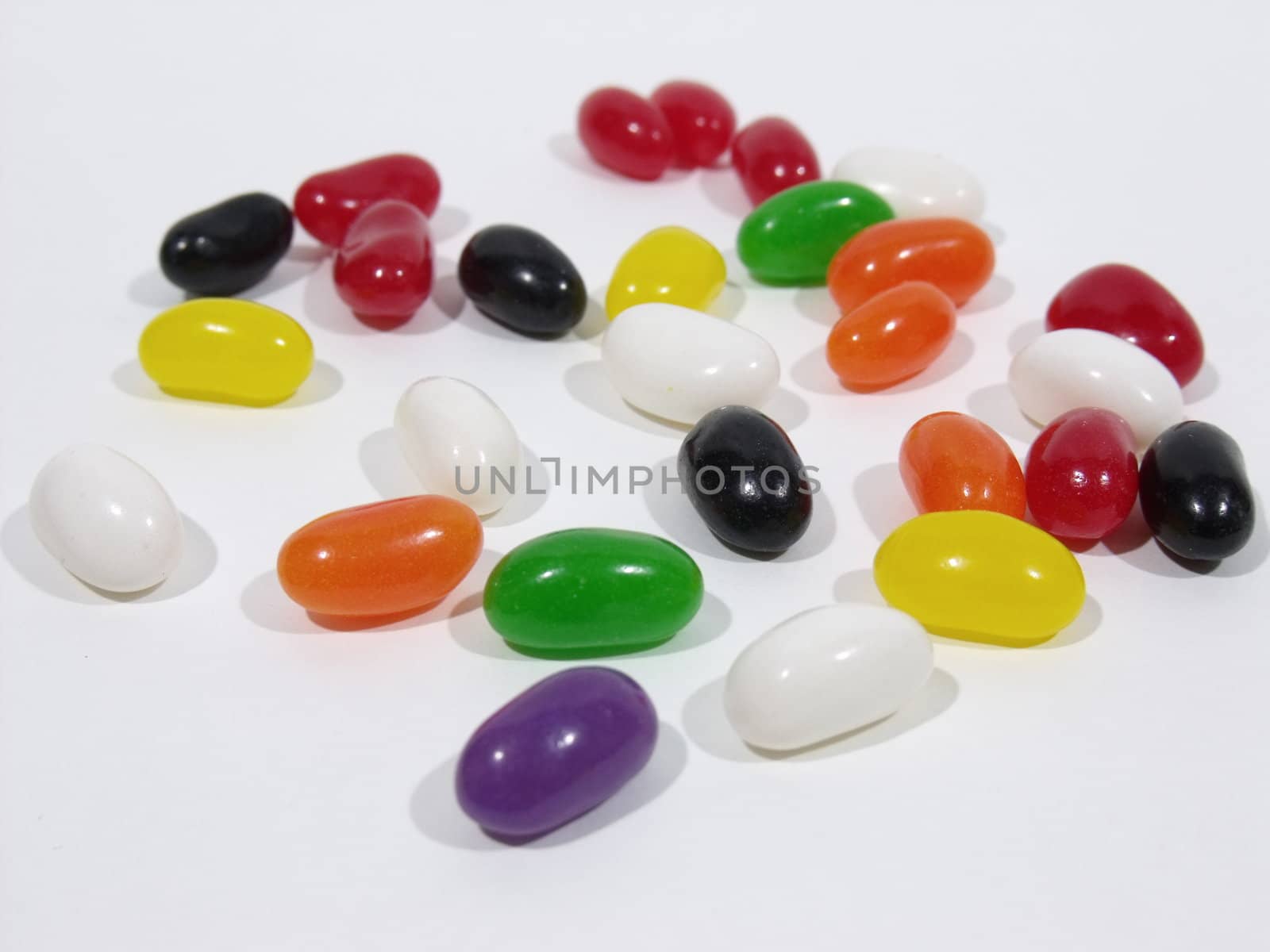 Large variety of jelly beans on a white table