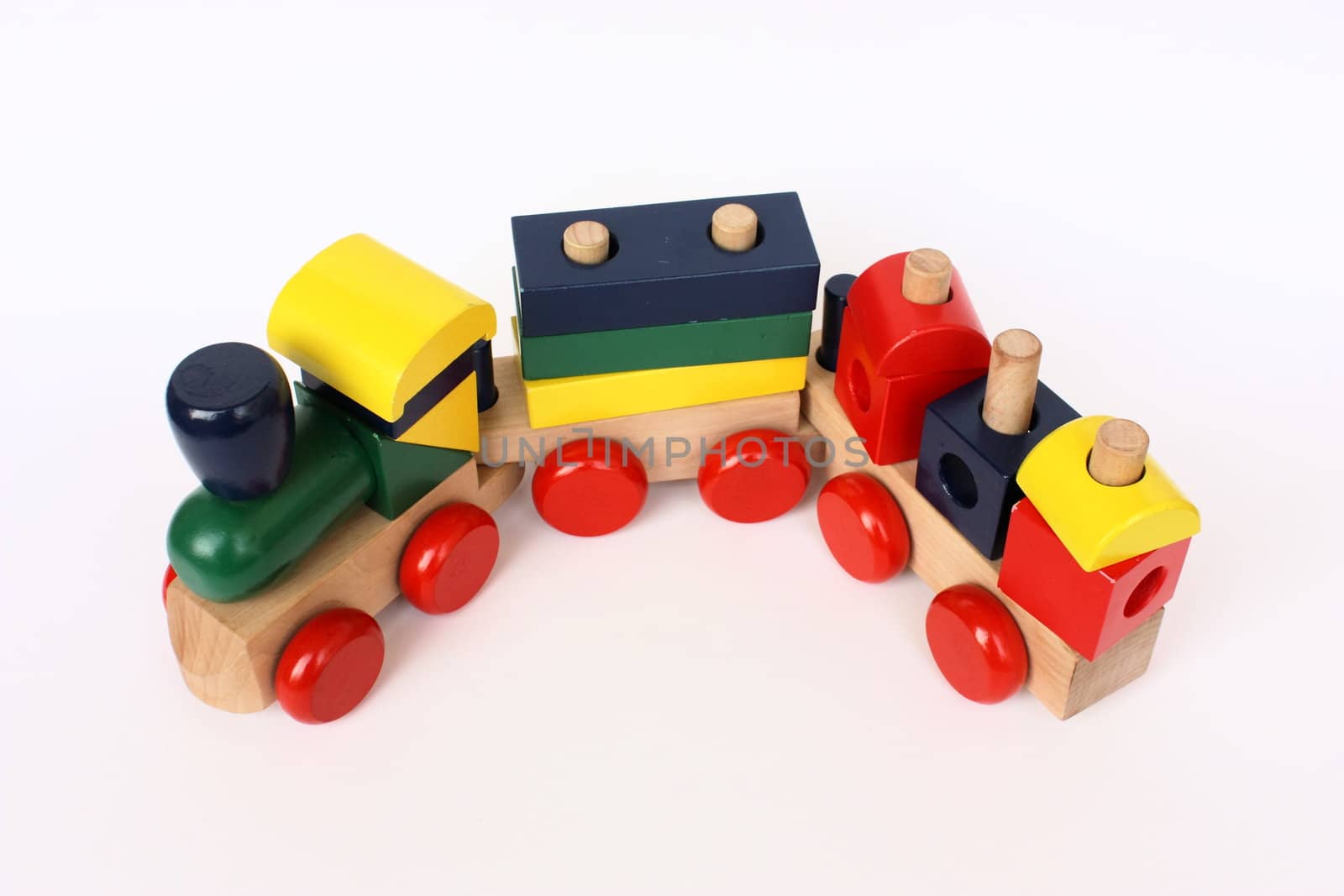 Wooden colorful child toy a locomotive with two wagons