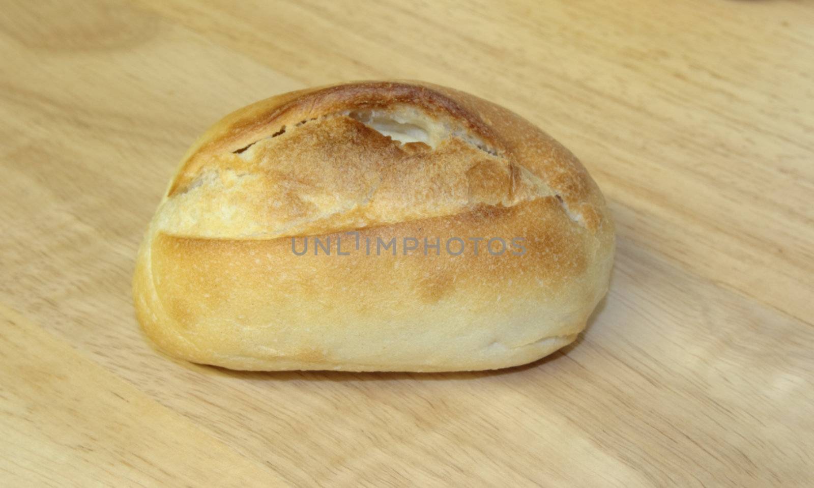 bread roll on a wooden board