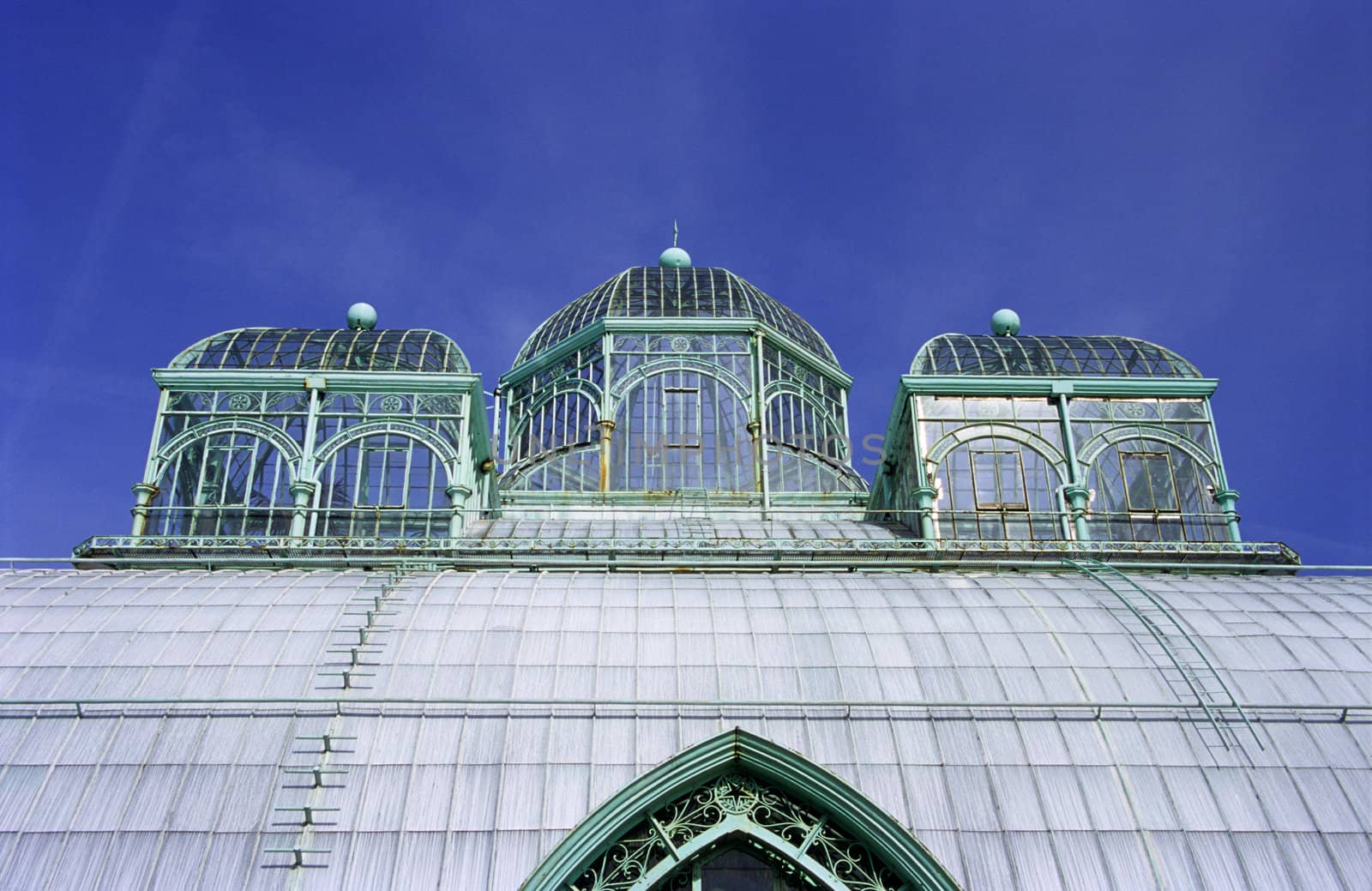 Ornate metal and glass roof of the Royal Gardens in Laeken, Belgium.