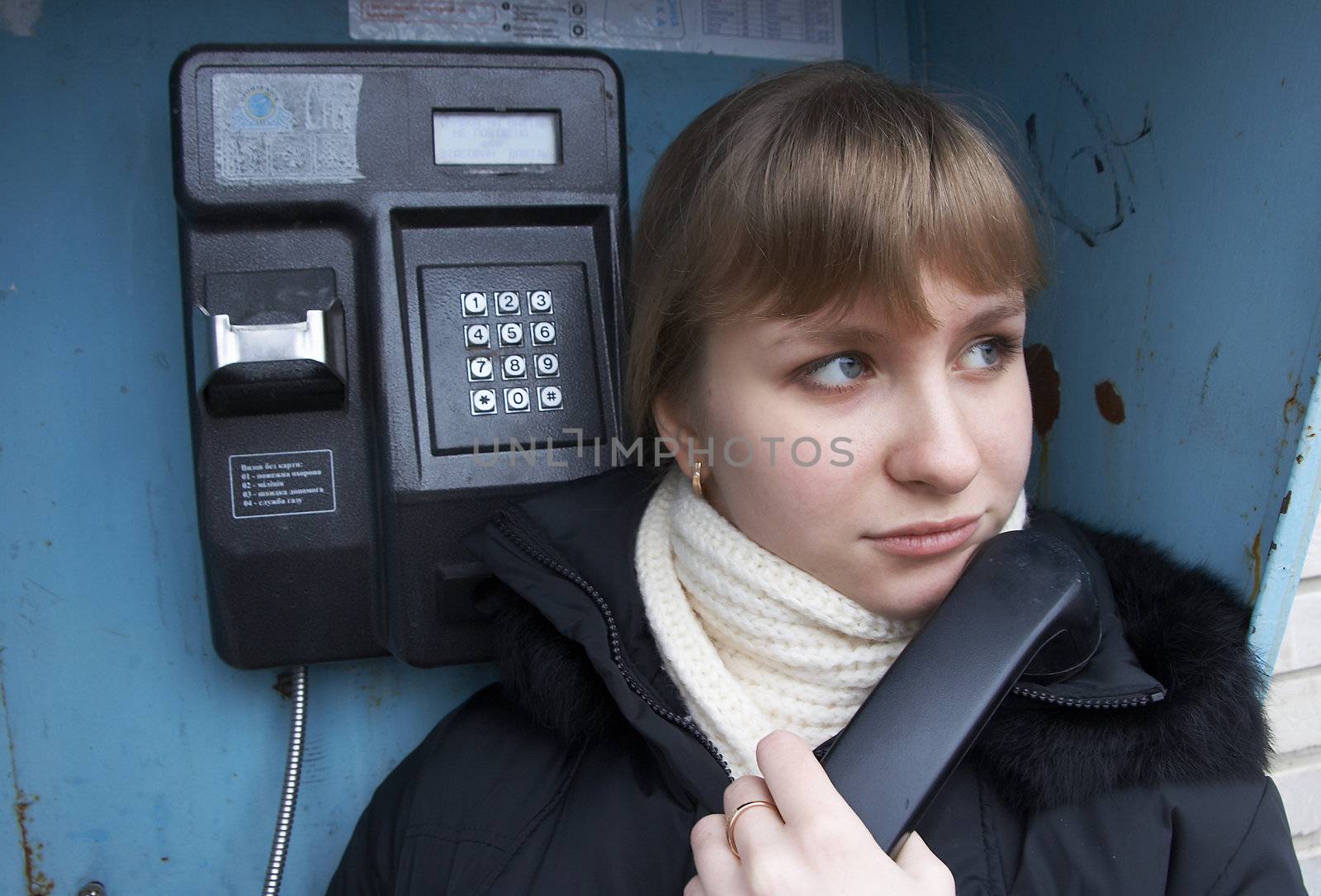 Upset girl with street phone