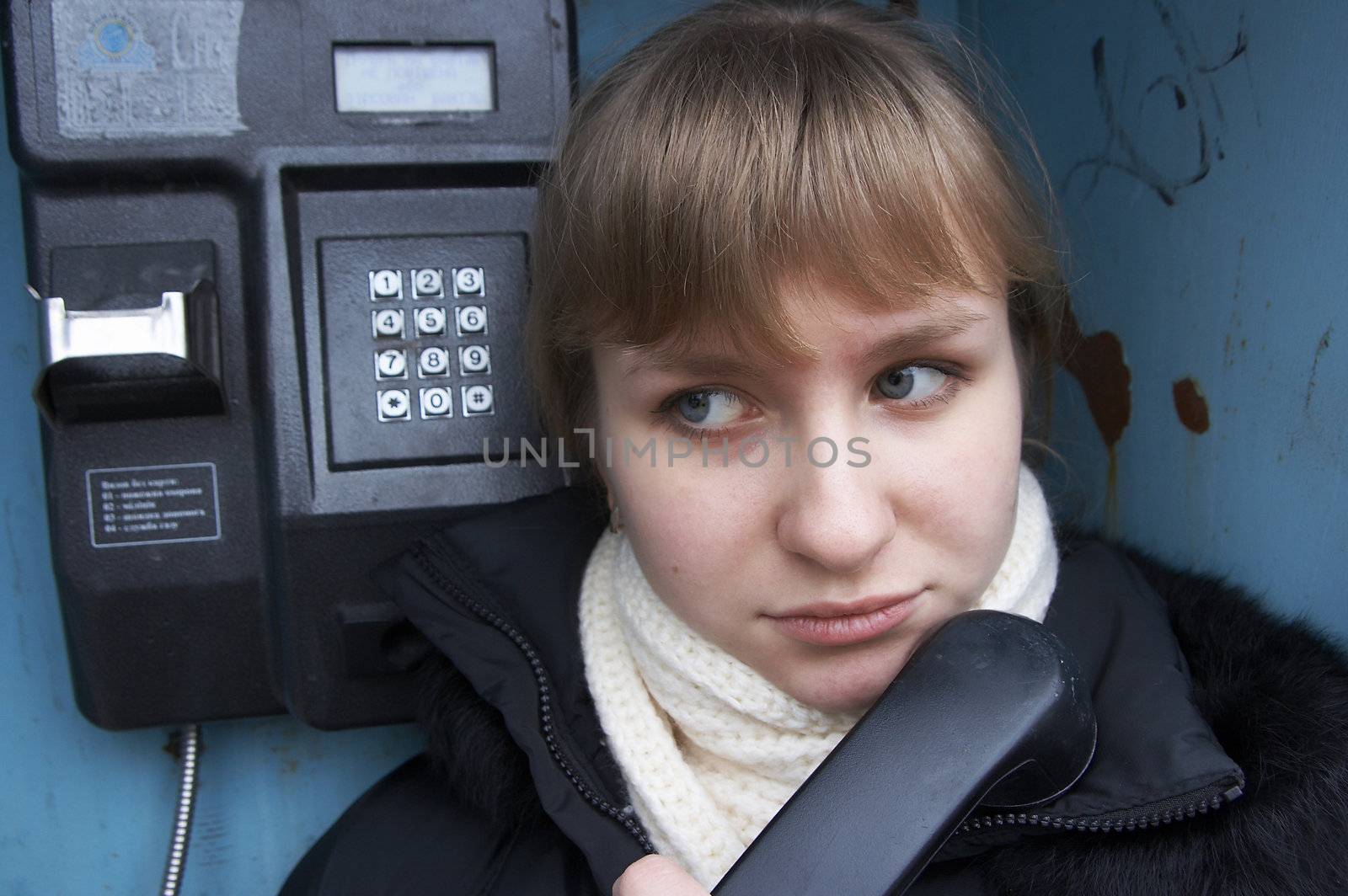 Upset girl with street phone by fotosergio