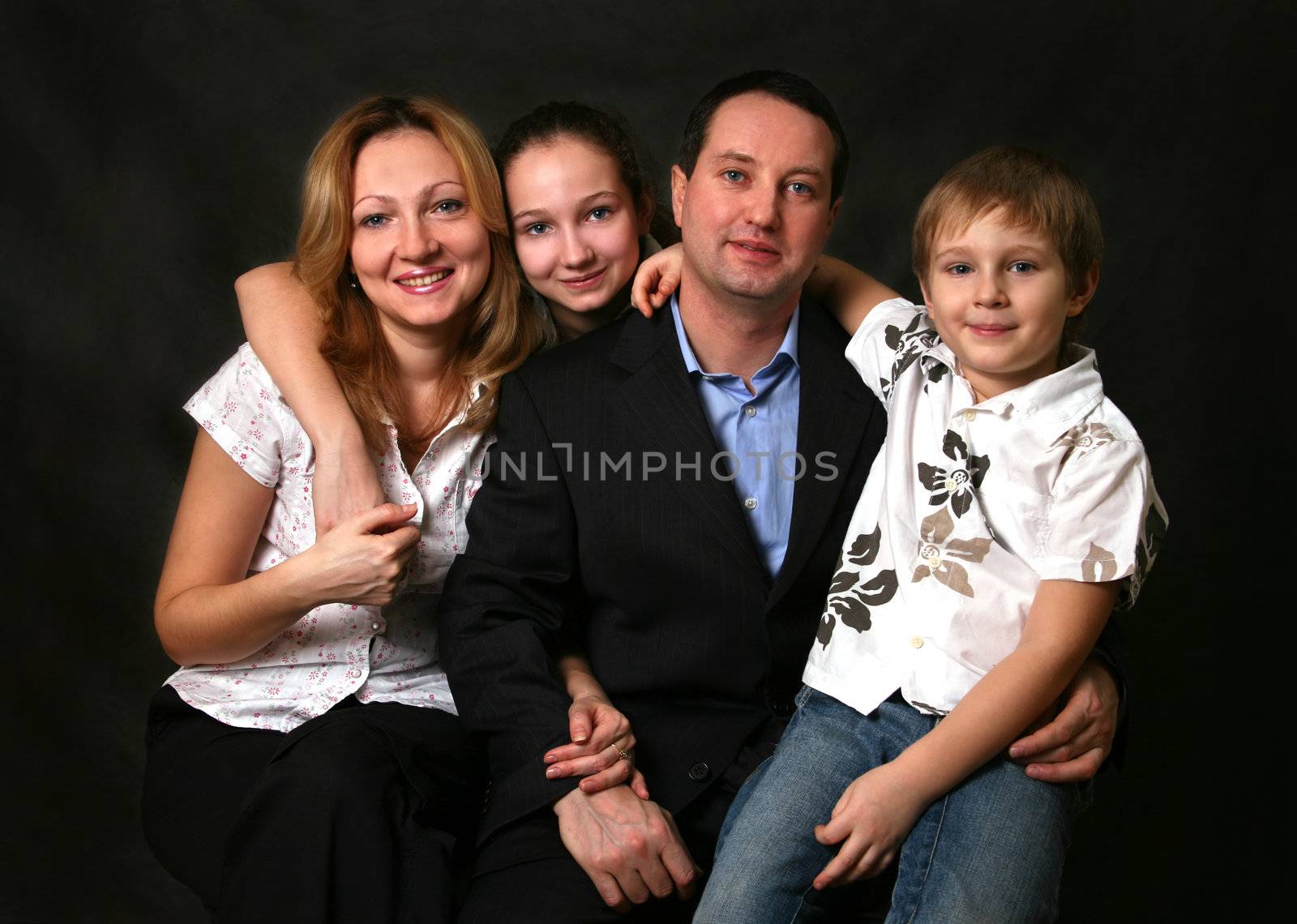 Portrait of parents and children in studio