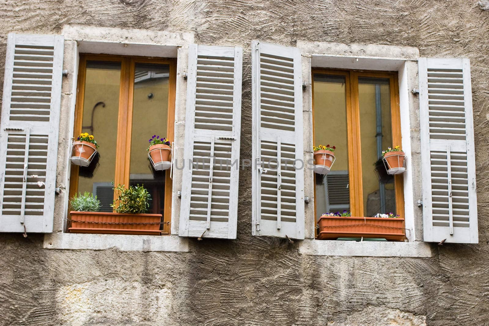 Shuttered windows at medieval town of Annecy, France