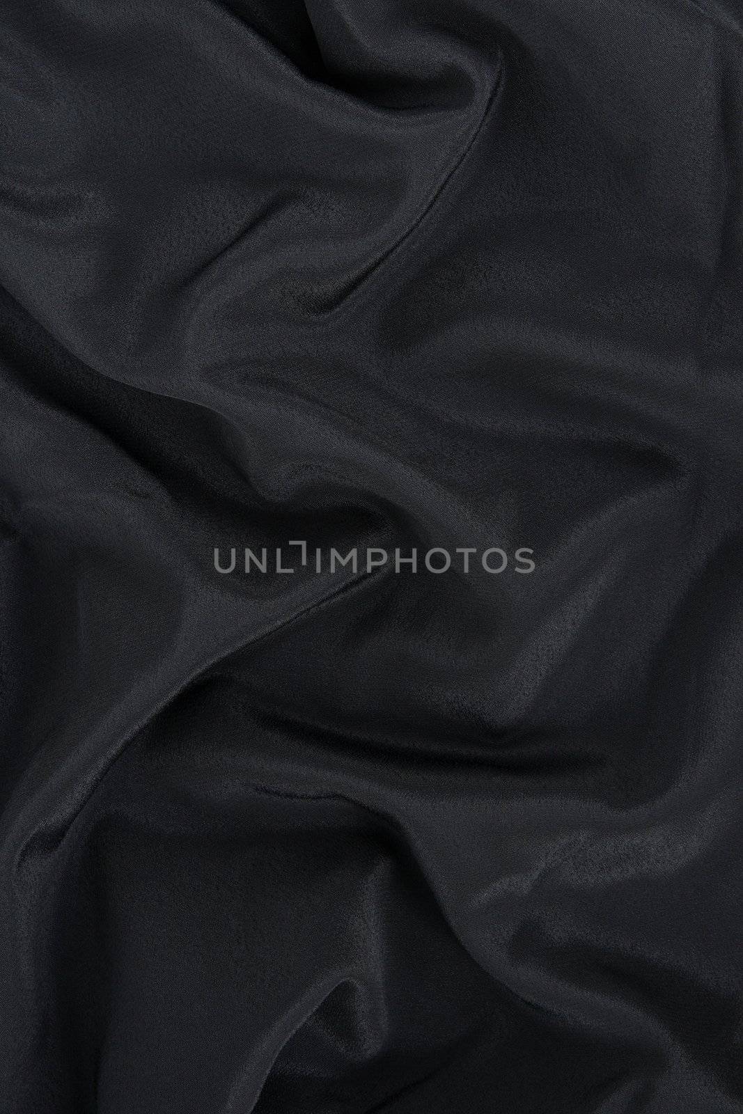 Black satin fabric. Abstract background.