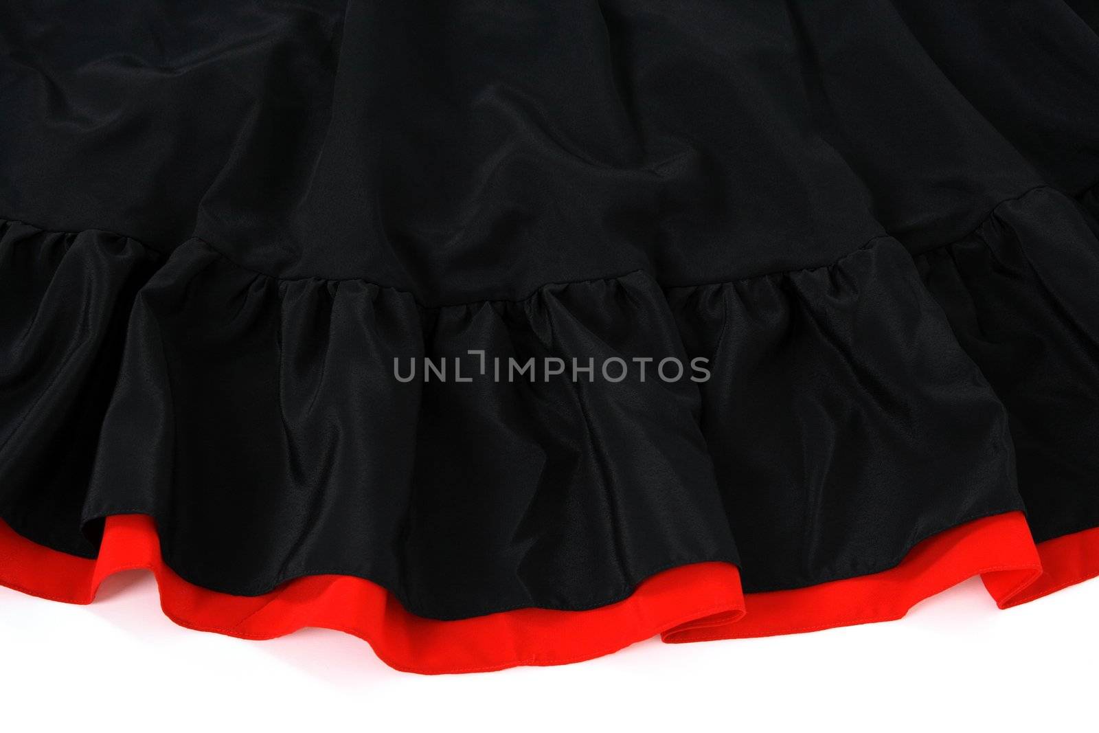 Black and red Spanish flamenco skirt on white background.