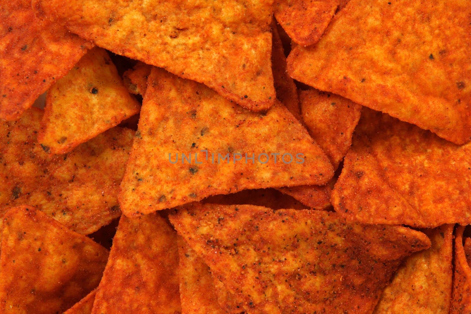 Hot and spicy corn chips. Abstract food textures.
