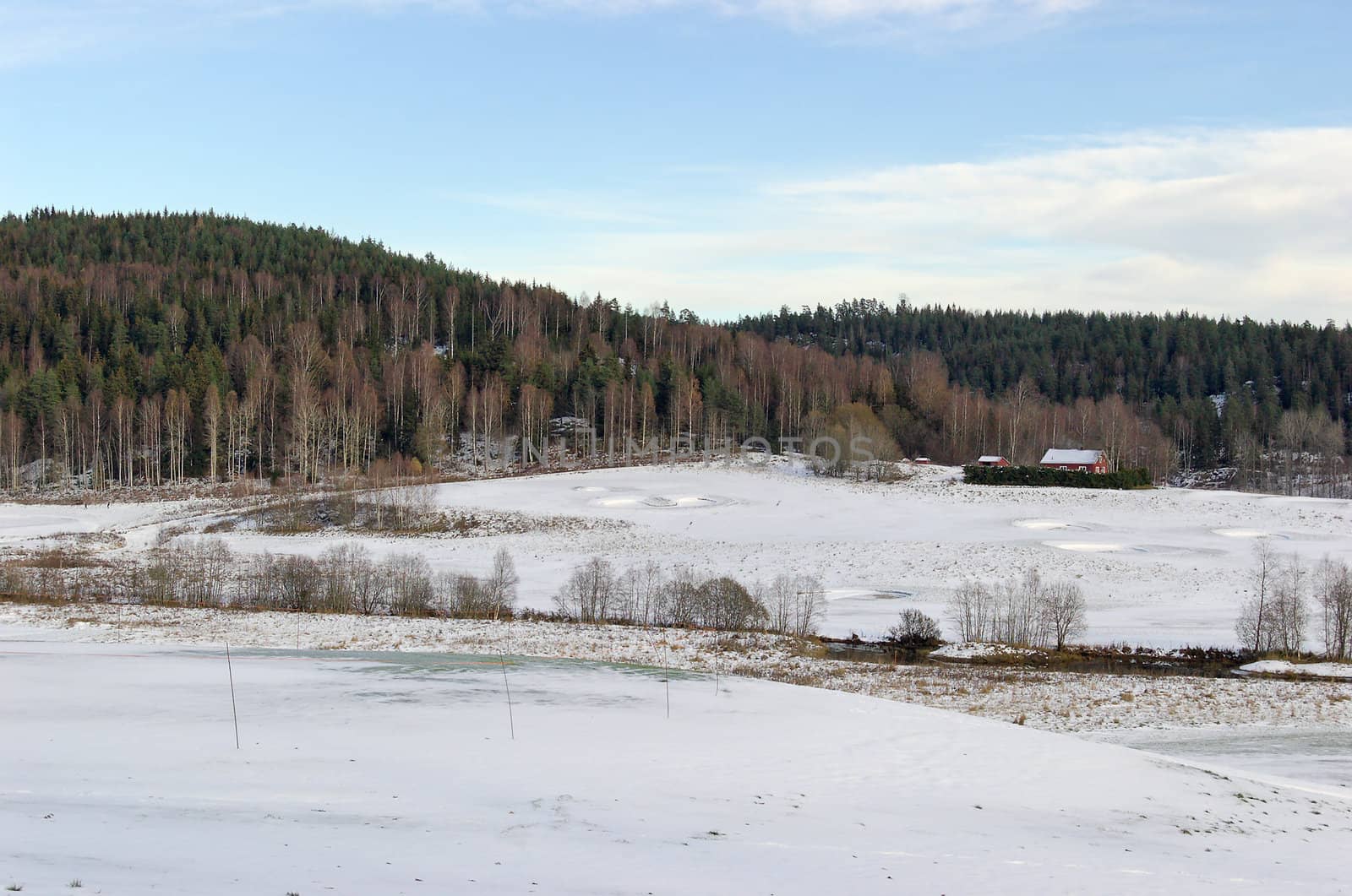 Open golf fields, covered by snow. Located in Losby, Norway
