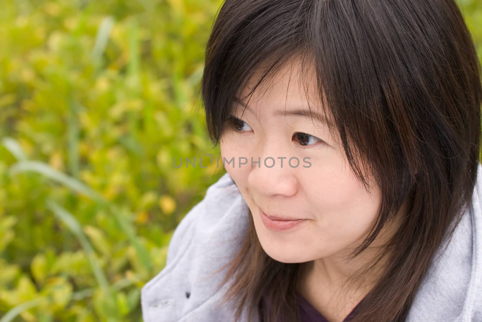 Sweet woman portrait of Asian with fun expression face in outdoor.