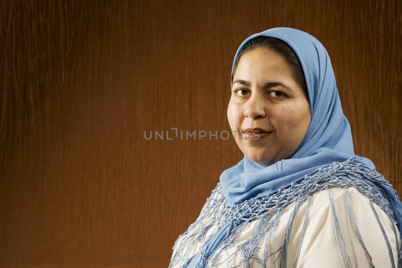 Portrait of a Muslim Woman in a Blue Head Scarf