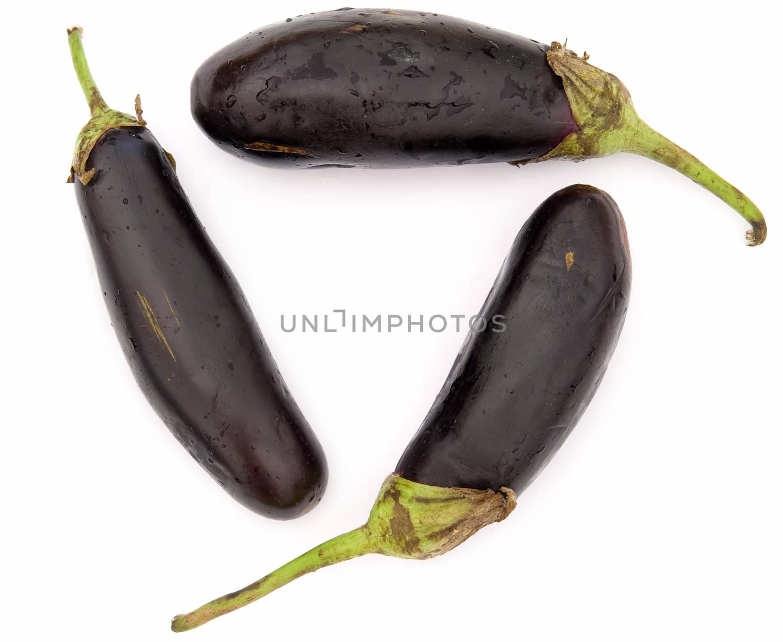 Three big eggplants on a white background.