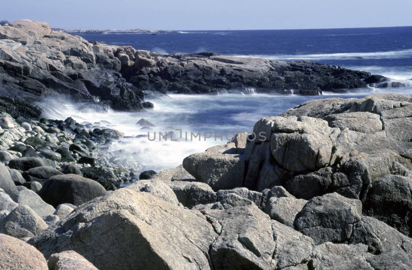 Waves of the Atlantic Ocean crashing on rocks in Nova Scotia, Canada.