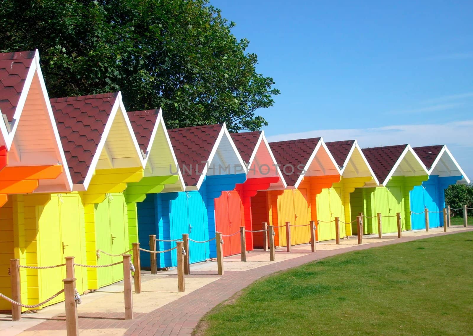 Exteriors of beautiful bright seaside beach chalets, Scarborough, England.