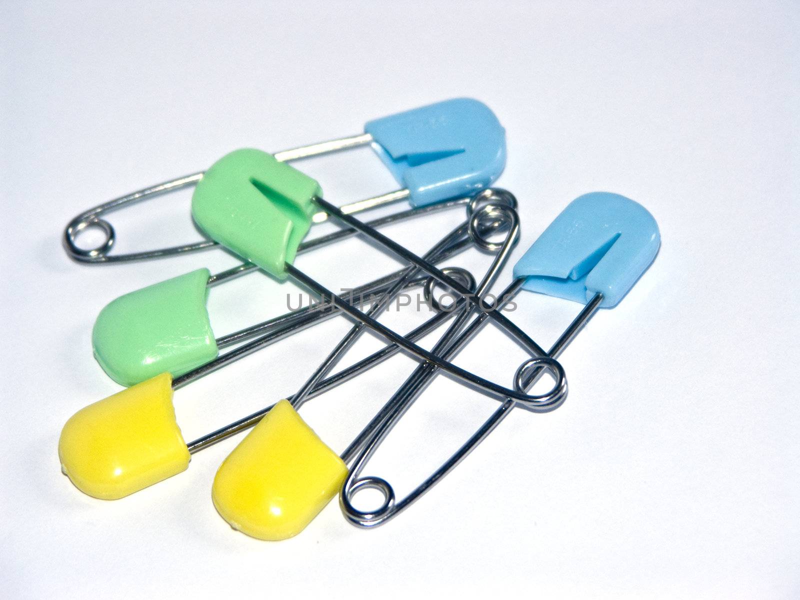 The image of six multi-coloured children's pins.