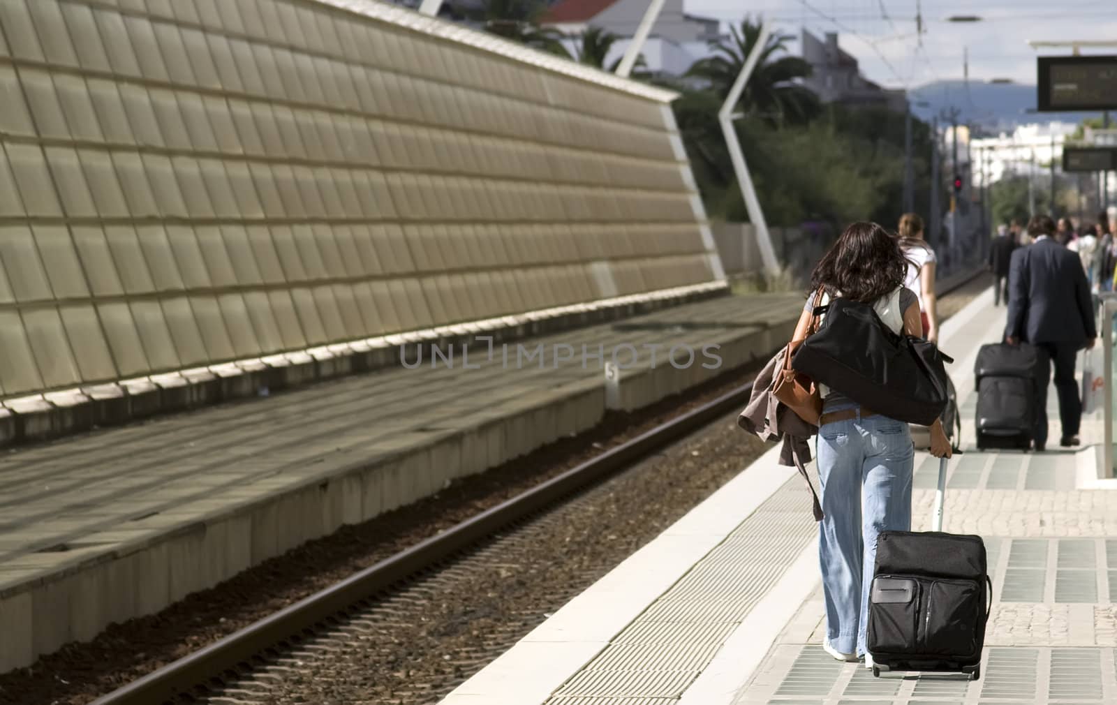 Cute girl going to vacation on train station