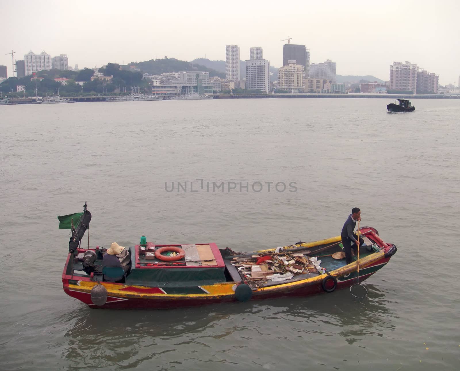 Fishing boat in Hong - Kong"s bay                