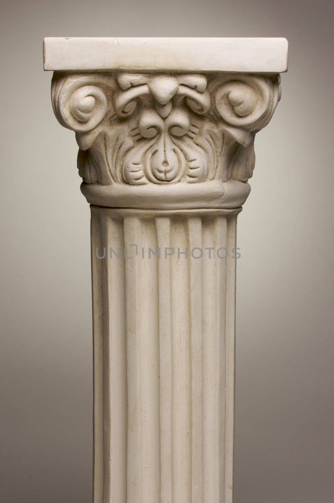 Ancient Column Pillar Replica on a Grey Gradation Background.