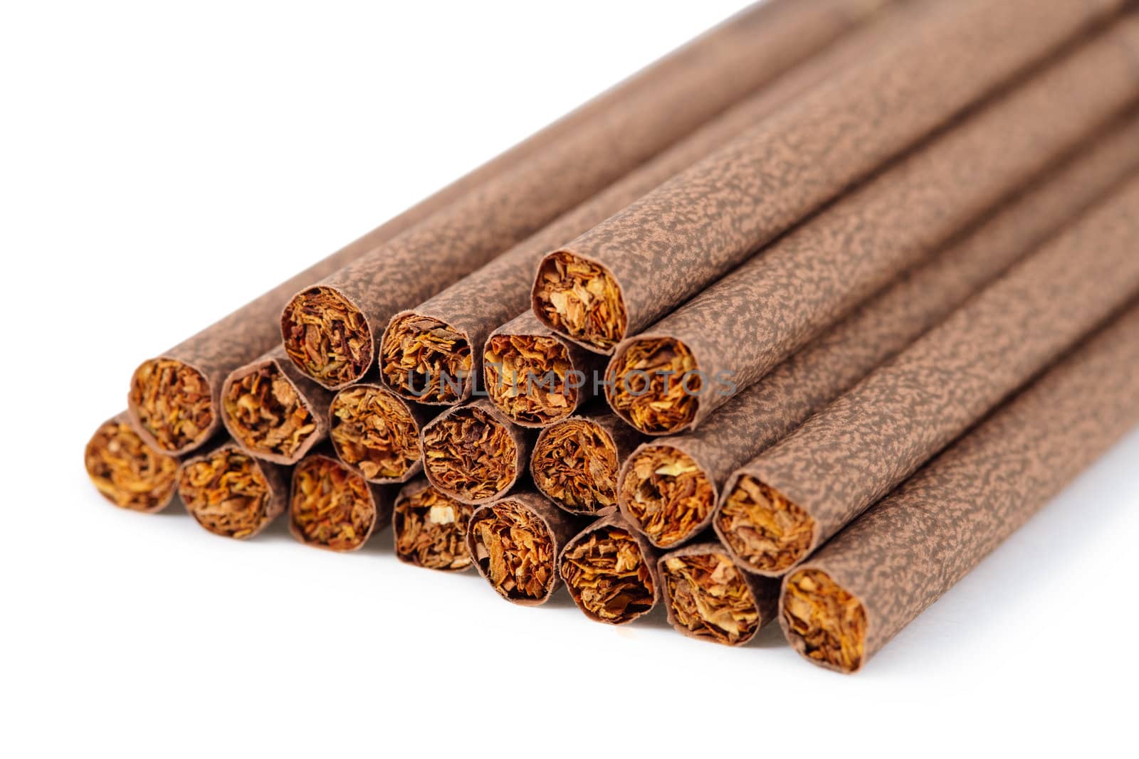 A handful of brown ladies cigarette on a white background