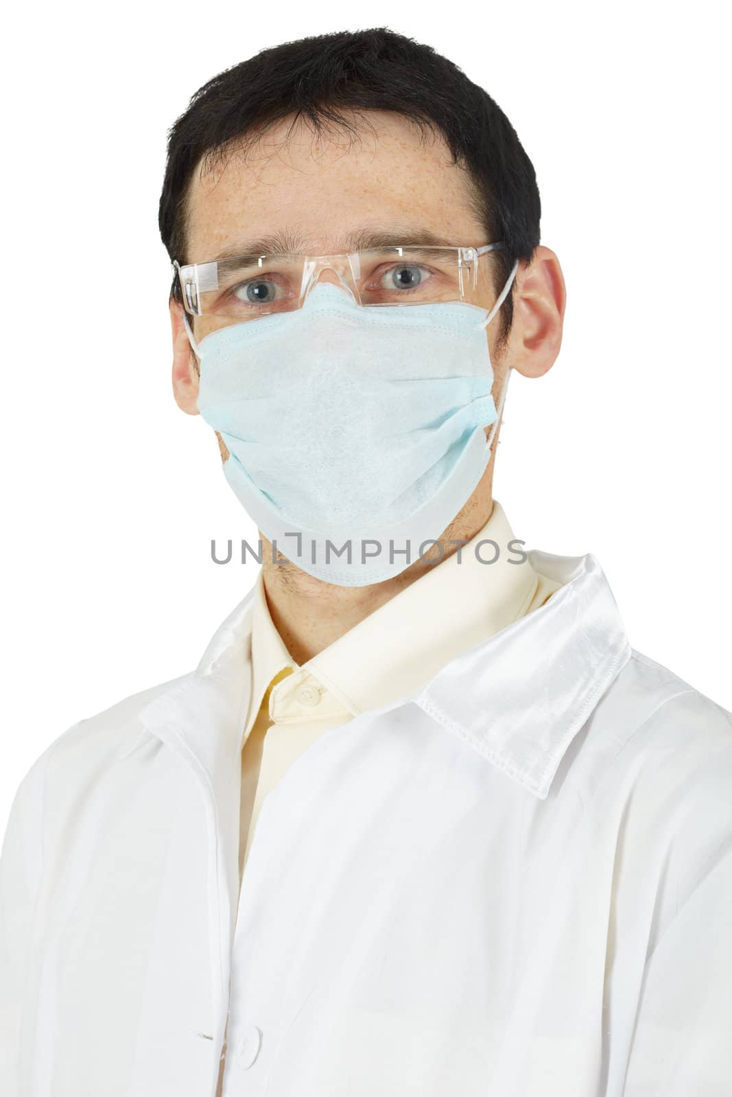 Portrait of a man - a doctor in a white coat and mask