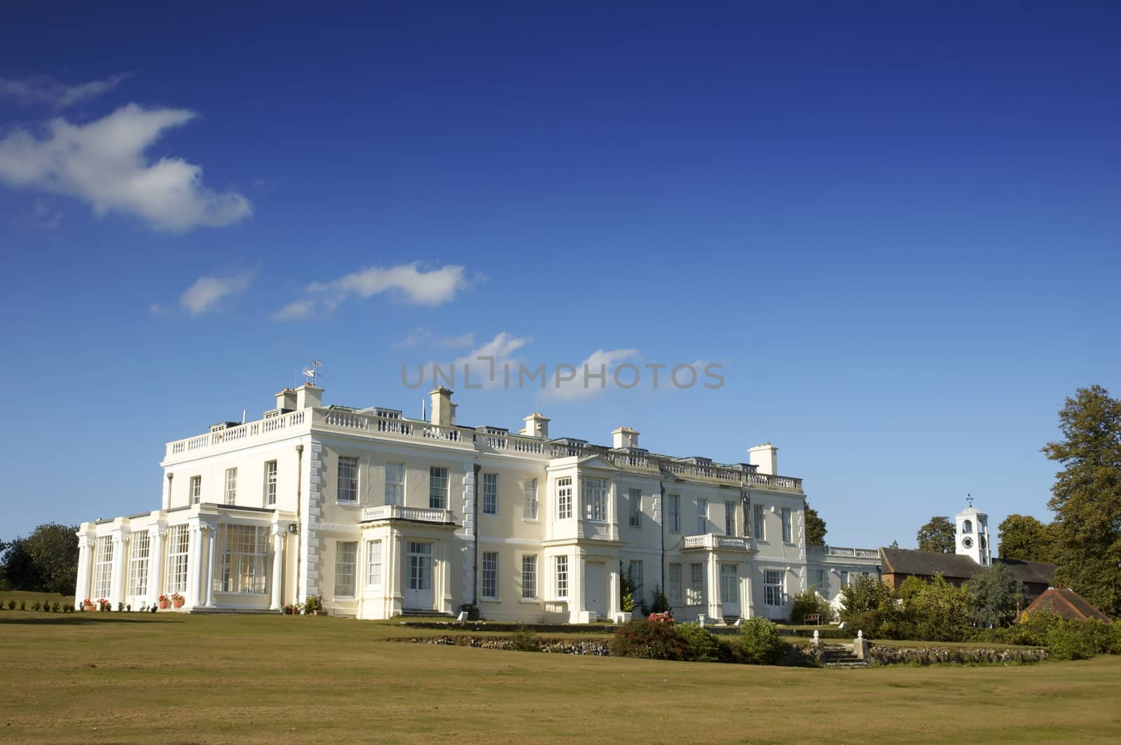 A large white house in the countryside