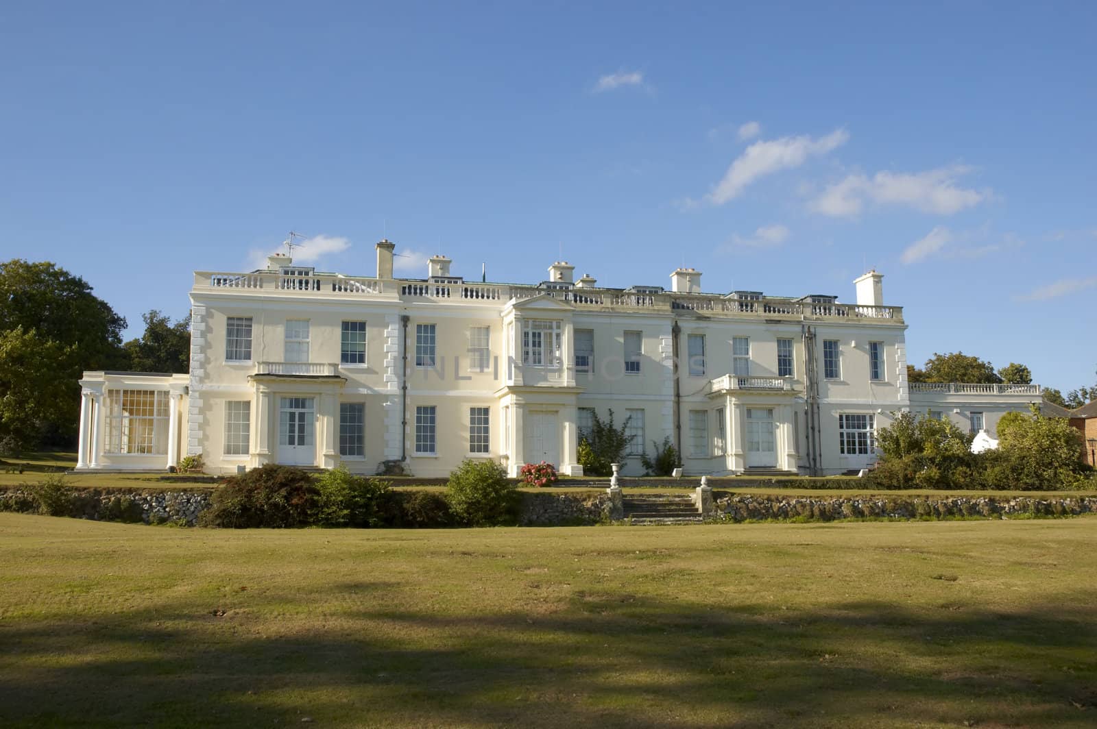 A large white house in the countryside