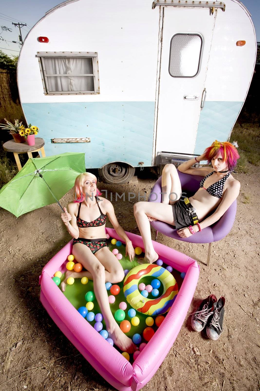 Women in front of a trailer by Creatista
