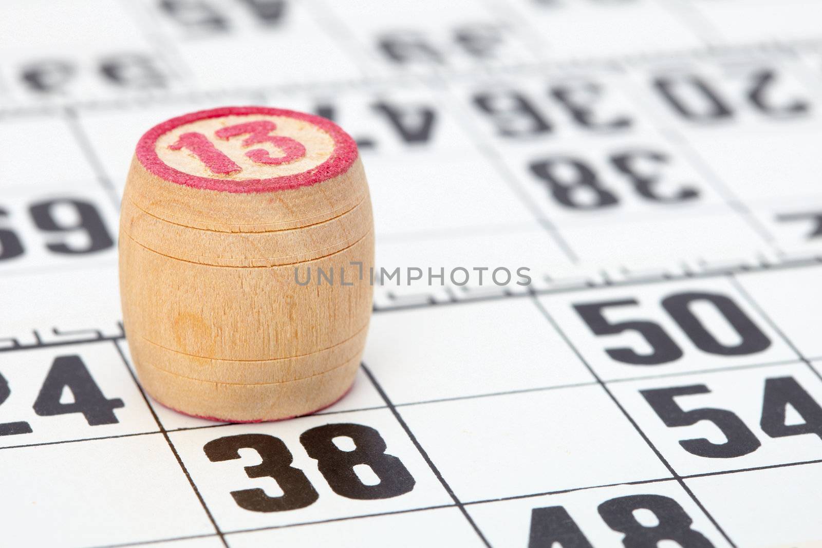Wooden barrel lotto with a red number thirteen