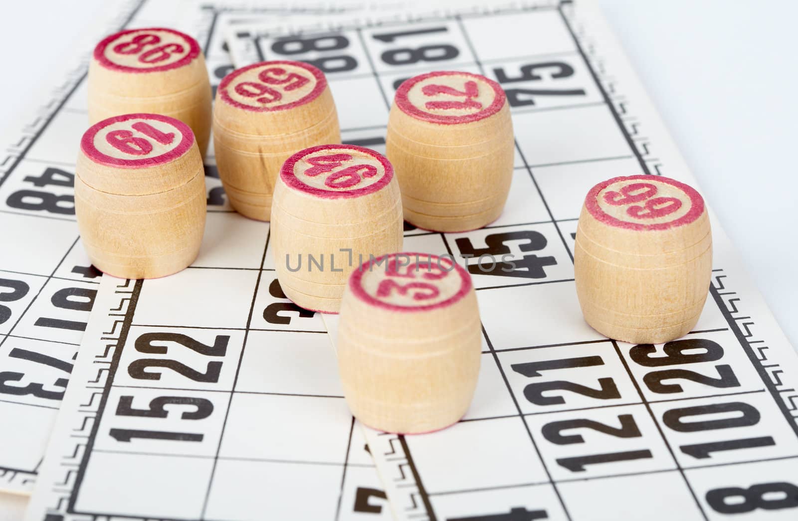 Kegs bingo, against a background of playing cards