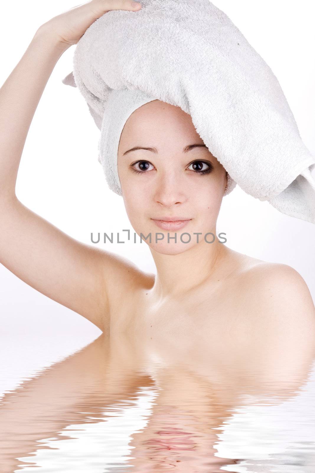 Young woman looking with a towel on her head