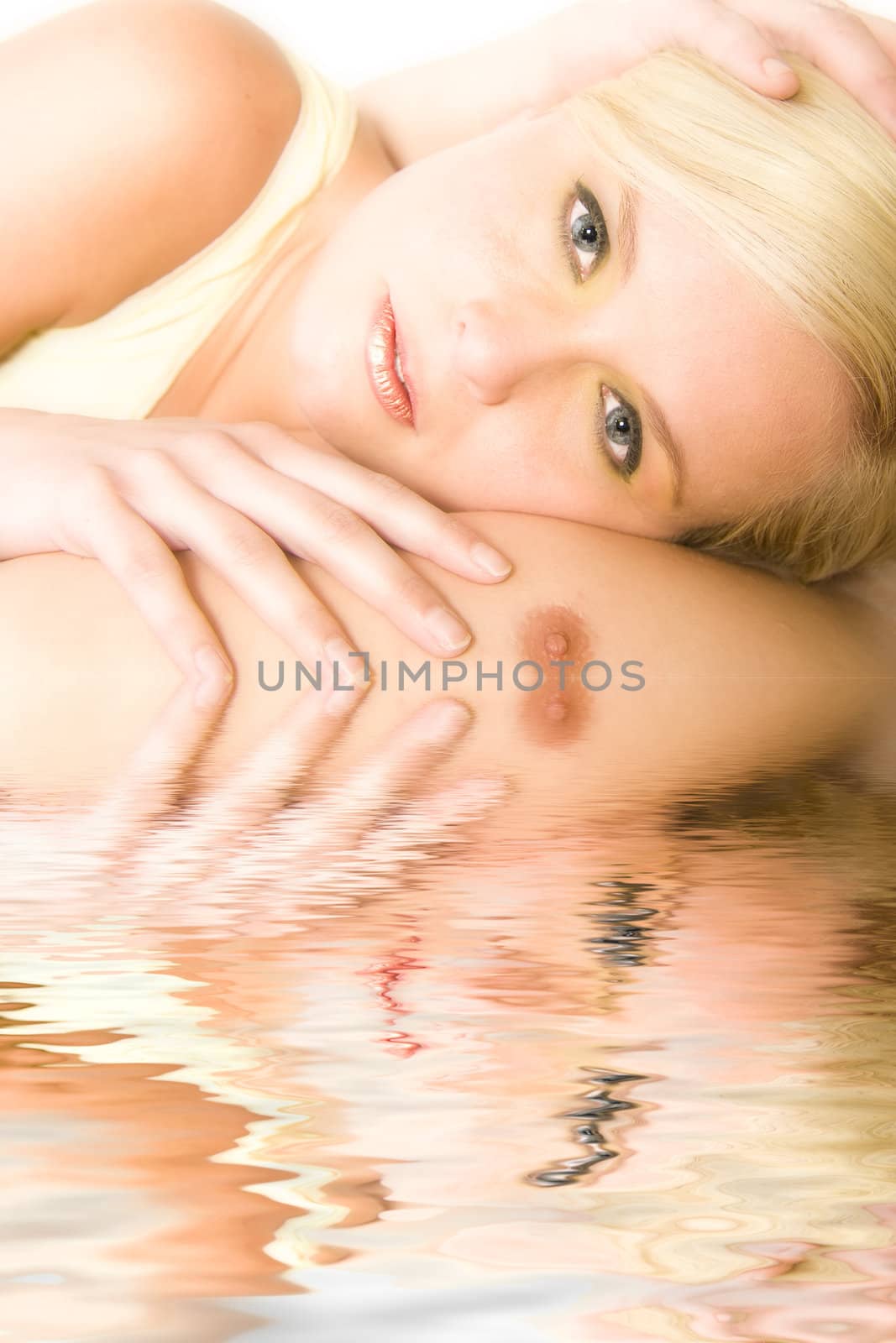 Portrait of a beautiful blond in the studio resting on het boyfriends chest